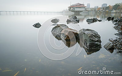 Foggy morning on the Dnieper River in the background of the city of Dnepropetrovsk, Ukraine. Stock Photo