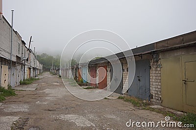 A foggy morning in garages where people leave cars for the night. Stock Photo