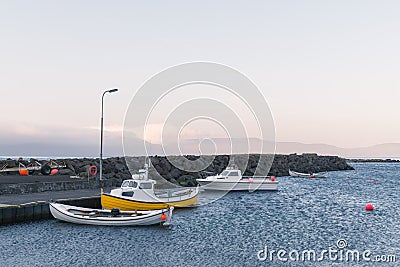 Foggy morning view of a boats docking in a small pier Stock Photo