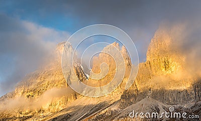 Foggy mountain landscape of the Dolomiti at Passo Sella area in South Tyrol in Italy Stock Photo