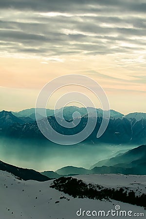 Foggy mountain scenery at sunset Stock Photo