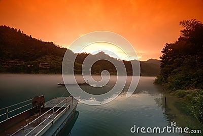 Foggy river in sunset Stock Photo