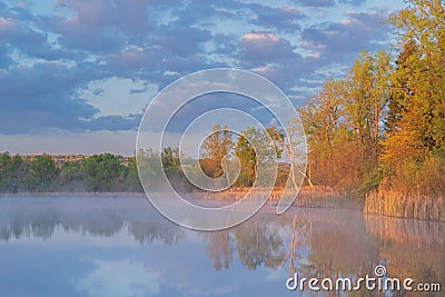 Spring Sunrise Whitford Lake with Reflections in Calm Water Stock Photo