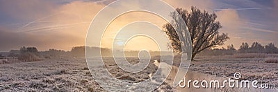 Sunrise over a frozen landscape in The Netherlands Stock Photo
