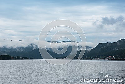 Foggy Teletskoye lake in Altai mountains Stock Photo