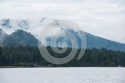 Foggy Teletskoye lake in Altai mountains Stock Photo