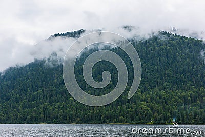 Foggy Teletskoye lake in Altai mountains Stock Photo