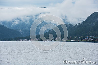 Foggy Teletskoye lake in Altai mountains Stock Photo