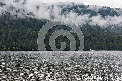 Foggy Teletskoye lake in Altai mountains Stock Photo