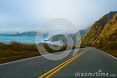 Foggy winding road Stock Photo