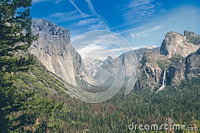Foggy Yosemite Valley. The rocks and waterfalls of the Yosemite National Park Stock Photo