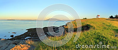 Gulf Islands National Park with Evening Light on Foghorn Station and Rosario Strait at East Point on Saturna Island, BC, Canada Stock Photo