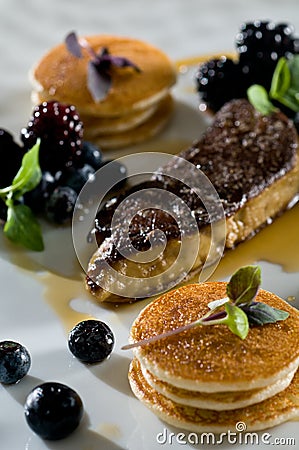 Foie gras with mini pancakes Stock Photo