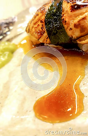 Foie gras sushi wrapped in algae and special sauce. Stock Photo