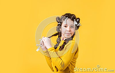 Foil hair-curling trick. kid hairdresser salon. healthy long hairstyle. hair care for child. little woman grooming Stock Photo