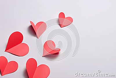 Fold paper Red hearts {Paper Heart cutting}, Heart of paper folding Isolated on White Background. Cards for Valentine`s Day There Stock Photo