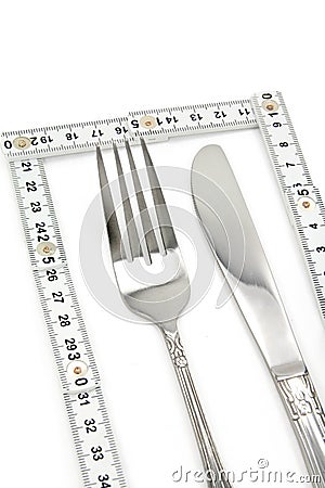 Foldable Tape Measure and fork Stock Photo