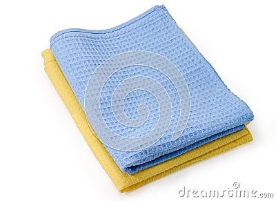 Folded blue and yellow waffle towels on a white background Stock Photo
