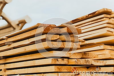Folded boards and logs on construction site Stock Photo