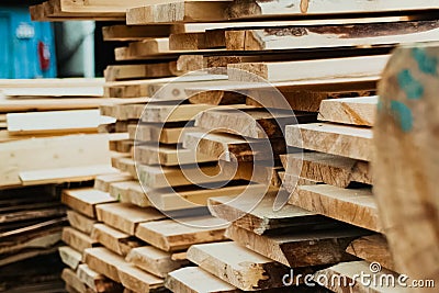 Folded boards and logs on construction site Stock Photo
