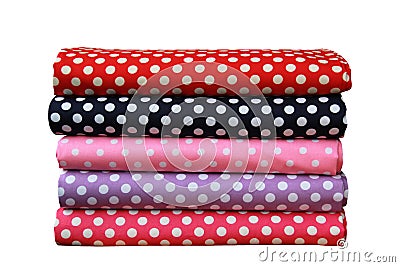 folded colorful polkadot pattern fabrics fold stack isolated on white background, clipping path Stock Photo