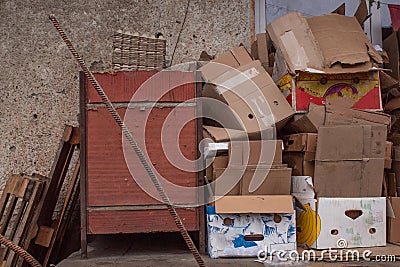 Folded empty boxes, boxes, containers, pallets on the back porch of the building Stock Photo