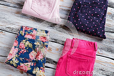 Folded pants with floral pattern. Stock Photo