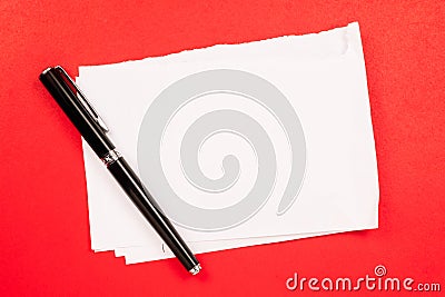 Folded paper on red background Stock Photo