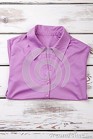 Folded purple women shirt. Stock Photo