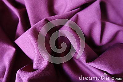 Folded reddish violet viscose stockinette fabric Stock Photo