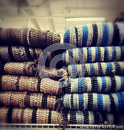 Folded rugs on sale in a store. Stock Photo