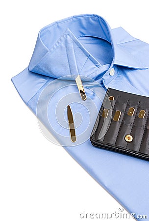 Folded shirt with gold collar stays Stock Photo