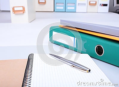 Folder file, note and pen on the desk. blurred background. Stock Photo