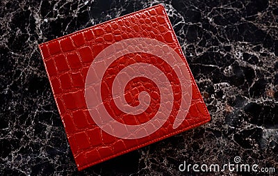 Folder, red leather cover with a large texture on a gray marble table Stock Photo