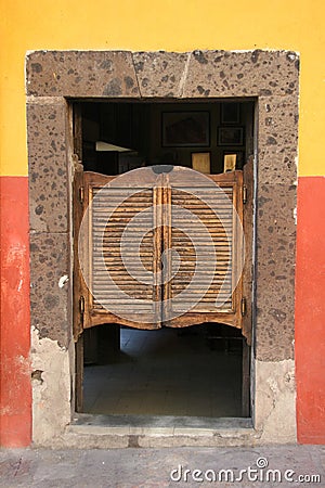 Folding door in old saloon Stock Photo