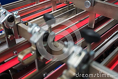 Folding Machine Red Belts Feed Wheels Metal Industrial Appliance Stock Photo