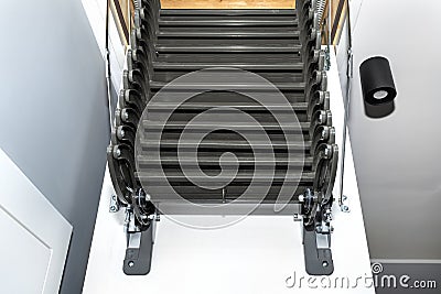 Folding metal stairs to the attic in the ceiling, open hatch and complex stairs, modern look. Stock Photo