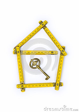 Folding ruler, house shape and key Stock Photo