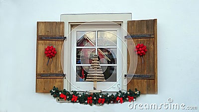 A folding shutters on the window with Christmas decorations Editorial Stock Photo