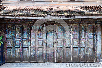 Folding wooden door is decorated with calligraphy and color chalk Stock Photo