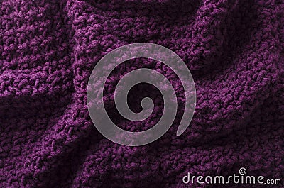 Folds of knitted fabric as a background.Top view of dark purple knitting texture Stock Photo