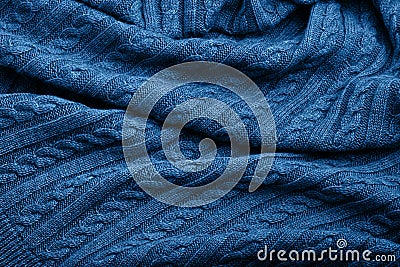 Folds of a knitted woolen blanket, blue color, top view Stock Photo