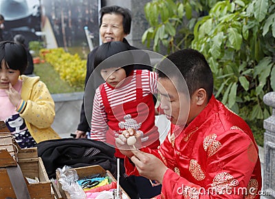 Folk artist make traditional chinese dough doll Editorial Stock Photo