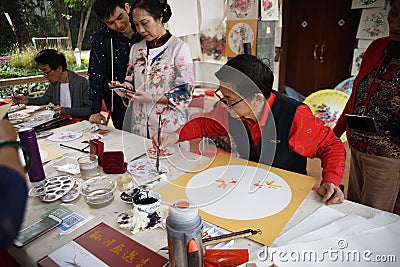 The folk craftsman who is making Chinese fans Editorial Stock Photo