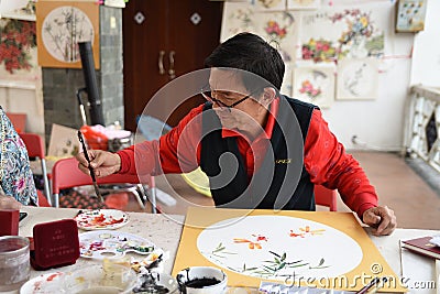 The folk craftsman who is making Chinese fans Editorial Stock Photo