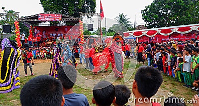Folk entertainment performing barongsai and reog arts, in the city of Muntok - Indonesia Editorial Stock Photo