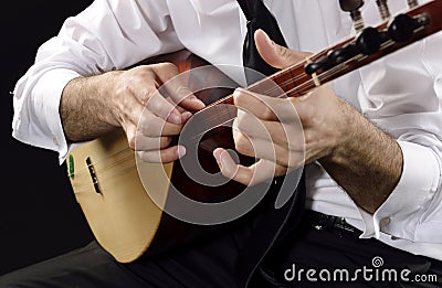 Folk instrument with three double strings Stock Photo