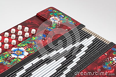 Folklore musical instrument, handmade Russian accordion with painting and inlay, isolated on a white background Stock Photo