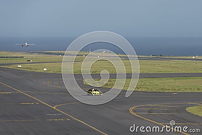 Follow me aviation marshall car waiting near the runway to guide Editorial Stock Photo