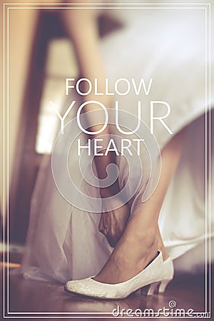 Follow your Heart over shoe of the bride in retro style. Stock Photo